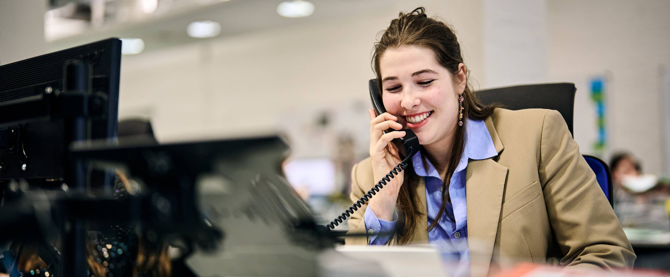 Women on the phone at her desk