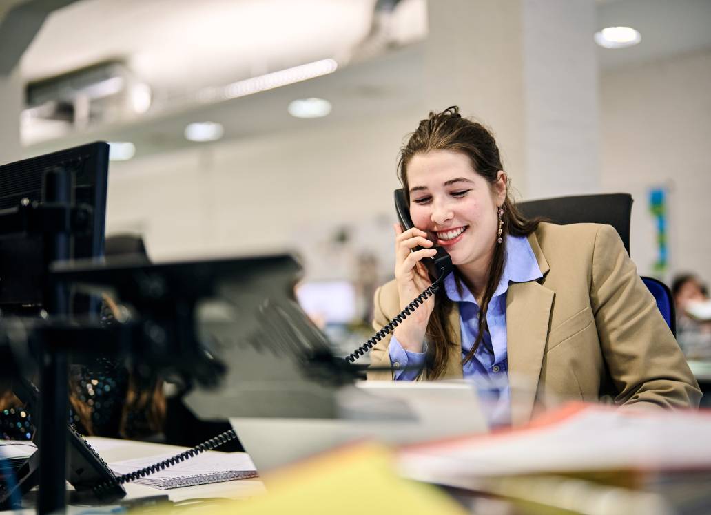 Women on the phone at her desk